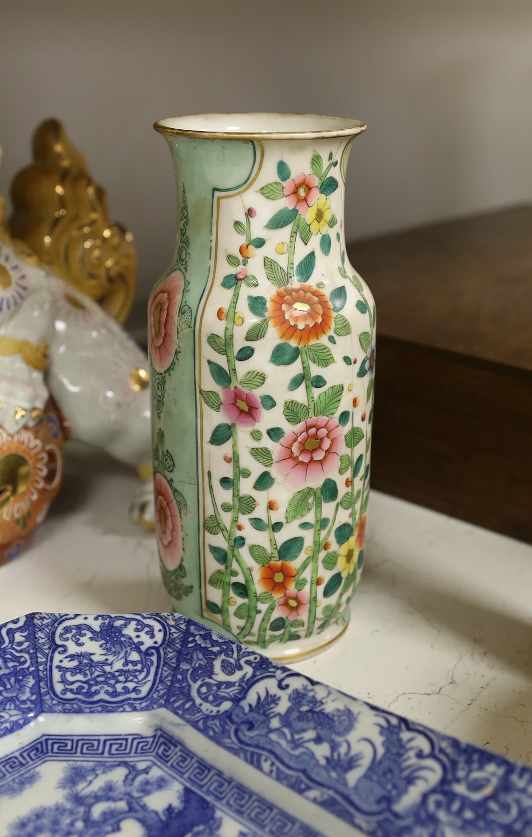 A collection of mostly Chinese ceramics, to include a vase, a lion dog, pestle and mortar etc.